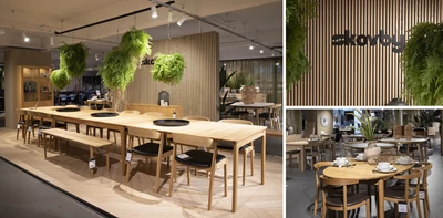 Skovby showroom med spiseborde og grønne hængeplanter